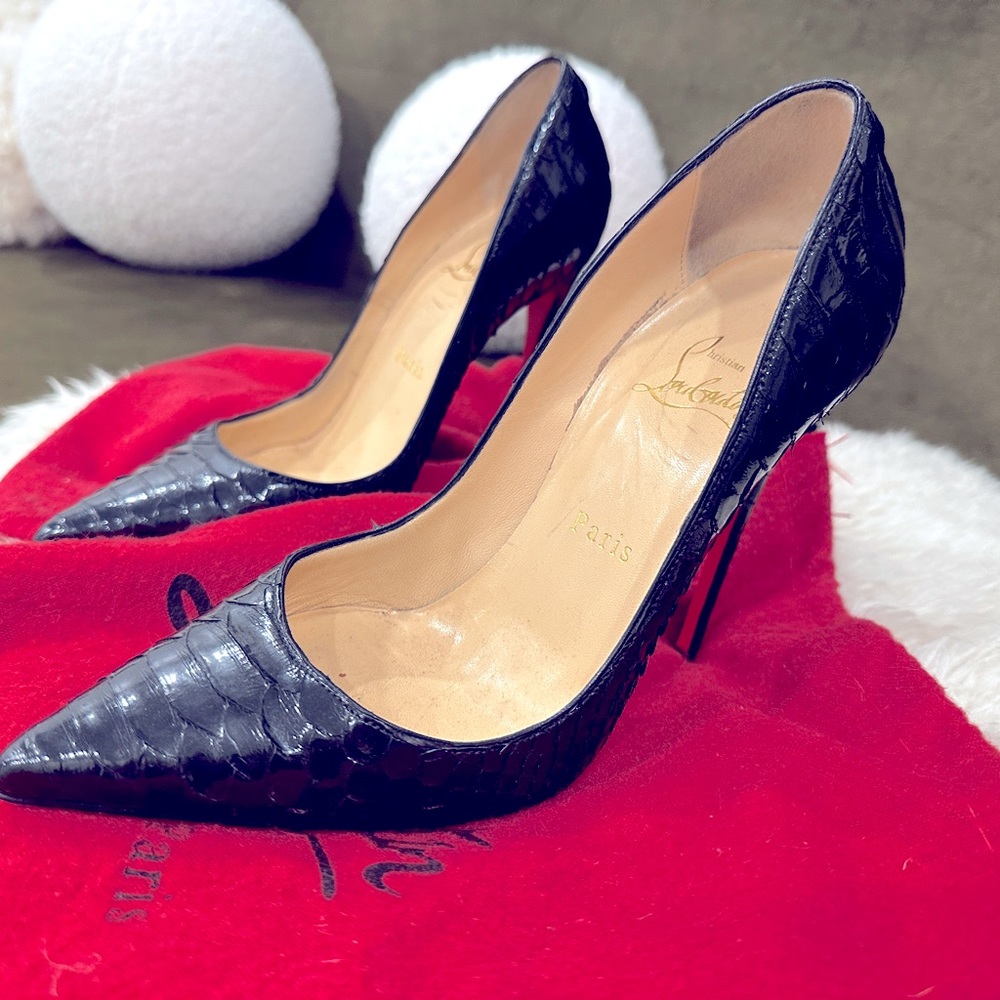 Christian Louboutin Python Pumps  Black
Heels: 4.75"
Shoe Size: 7